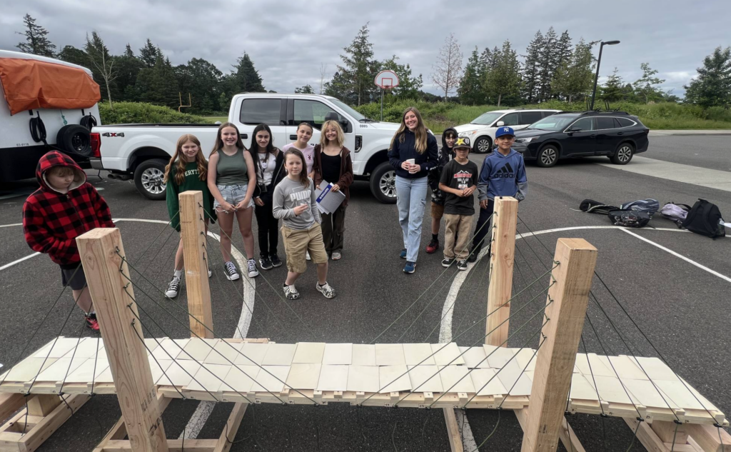 Students built a bridge with the Ballard Marine Construction team.